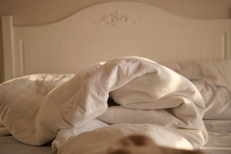 messy bed in early morning , messy bed after waking upの写真素材