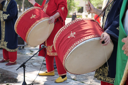 A man hit the ancient drum with Musical Instrument.の写真素材