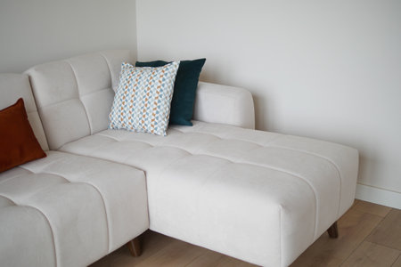 modern sofa with pillows in living room at homeの写真素材