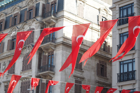 A low angle shot of Turkish national flag hanging on a rope in the street