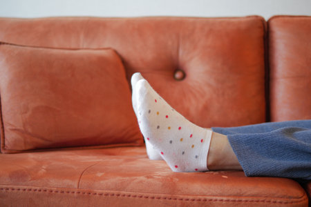 relax women feet lying on sofa in a bright houseの写真素材