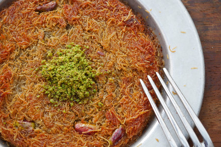 Kunefe. Traditional Turkish cuisine. Kunefe with pistachio