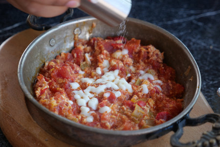 Turkish Menemen omelet in a frying pan. .の写真素材