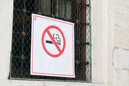 No smoke sign on a tree at public park.の写真素材