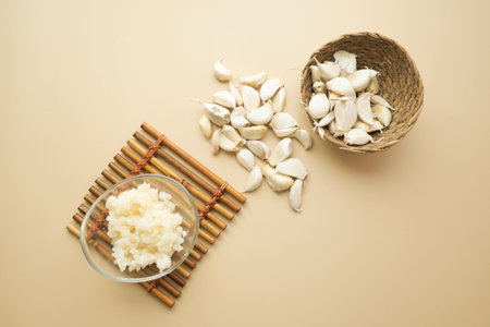 top view of minced garlic in a bowl on tableの写真素材