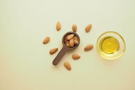 almond oils and fresh nuts on tableの写真素材