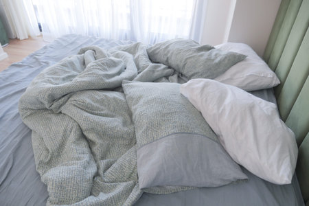 messy bed in early morning , messy bed after waking up