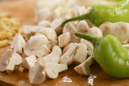 Fresh chopped champignons mushroom on a chopping boardの写真素材