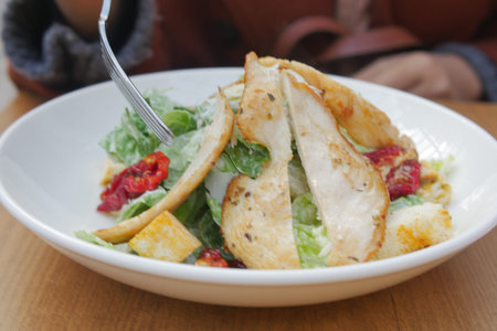 Caesar Salad in a bowl on table,の写真素材