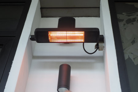 Modern electric infrared heater on cellingの写真素材