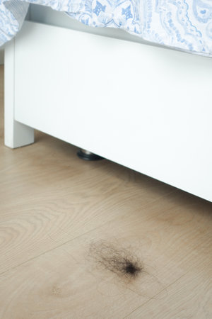 women lost hair drops on floorの写真素材