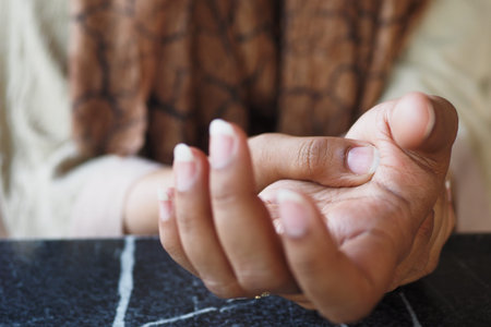 Young women hands suffering wrist pain,