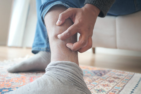 man suffering from itching skin on his feet