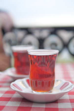 Traditional turkish tea on white table .