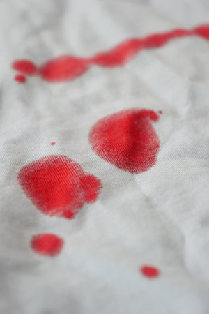 blood stains on a white shirt.の写真素材