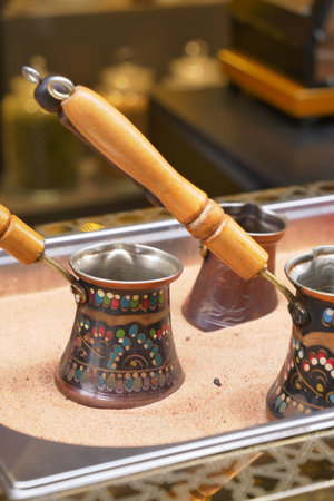top view of making traditional turkish coffee on sandの写真素材