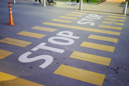Stop sign on a empty roadの写真素材