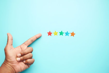 Customer review concept. Rating golden stars on blue background