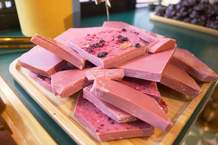Wooden tray with magenta chocolate on a table at the eventの写真素材