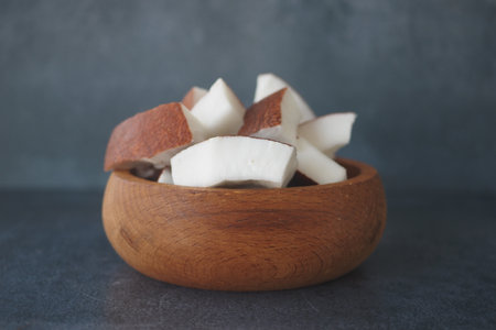 slice of fresh coconut on a table clothの写真素材