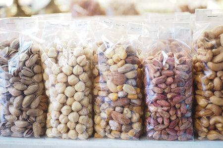 many mixed nuts in a plastic packet on shelfの写真素材