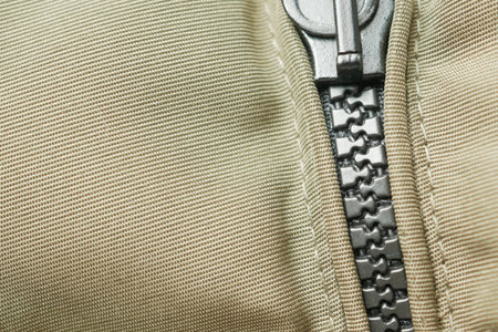 Close-up of a zipper with a sliderの写真素材