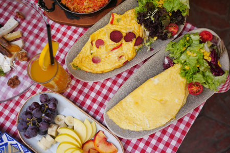 Egg Omelette with sausage on a breakfast tableの写真素材