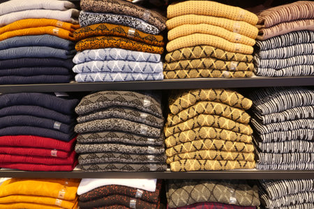 Colorful Shirts on shelf in a retail shopの写真素材