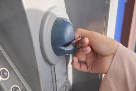 Hand Using Credit Card To Withdrawing Money From Atm Machine.