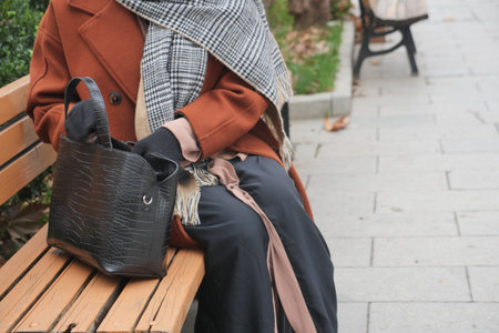 women looking for something in her purse