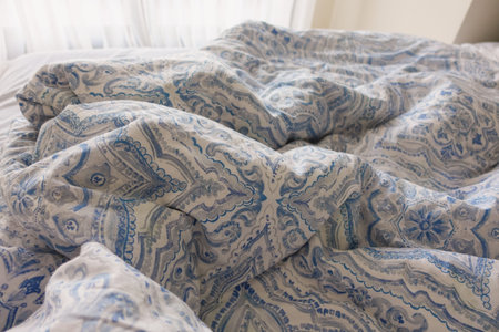 messy bed in early morning , messy bed after waking upの写真素材