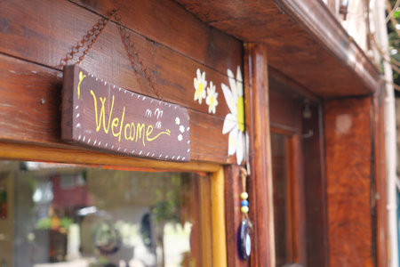 welcome text hanging on cafe door