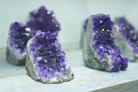 Various rocks are showcased on a table for art display