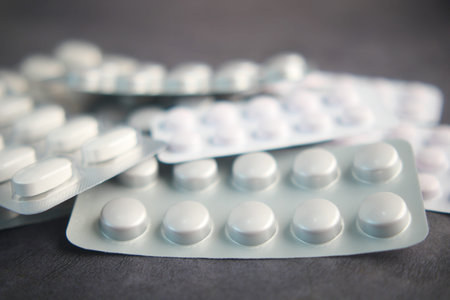 Close up of pills of blister pack on table