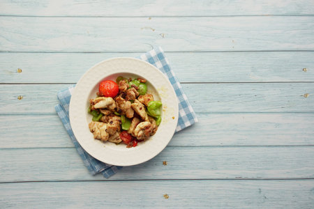 Delicious roast chicken served with vegetablesの写真素材