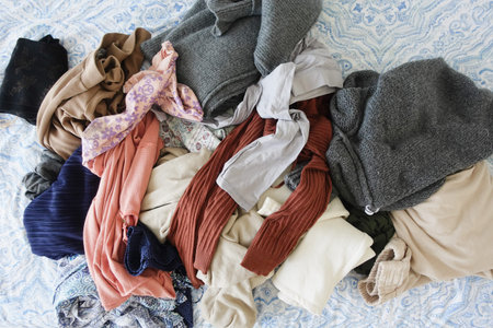 messy bed with cloths in early morning , messy bed after waking up