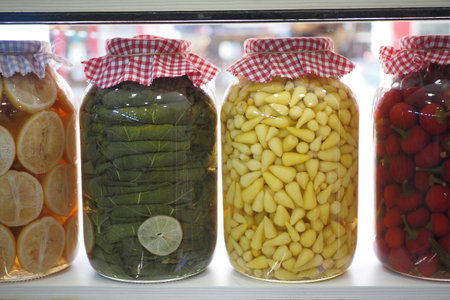 Canned fruits and vegetables in glass jarsの写真素材