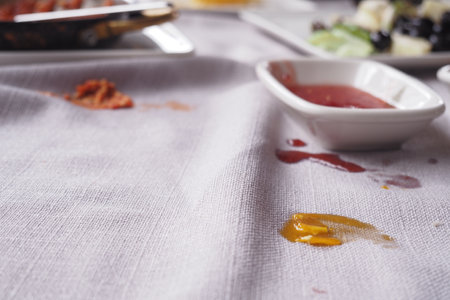 foods spilled over the breakfast table.の写真素材