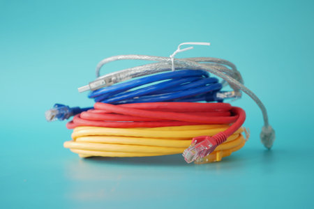Stack of colorful elastic rubber bands on table