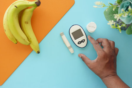 top vie of diabetic measurement tools and banana on a tableの写真素材