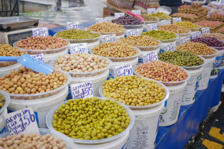 turkey istanbul 22 july 2023 . Buckets of olives for sale street food marketのeditorial素材