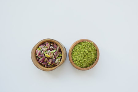 Wooden bowl filled with pistachios, a natural and nutritious superfoodの写真素材