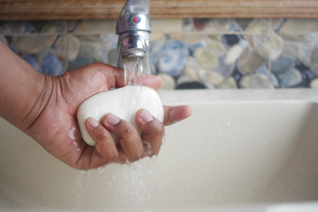 Maintaining hand cleanliness and preventing germs involves hand washing with soap and running water