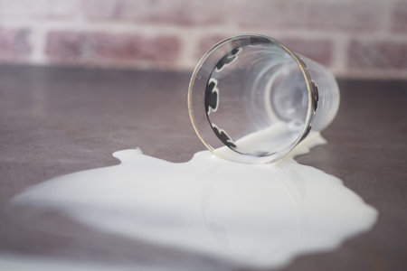 Spilled white milk on a tableの写真素材