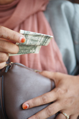 closeup shot person holding dollar billの写真素材