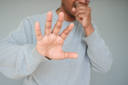Sick man got flu allergy sneezing and blowing nose