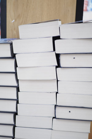 stack of books on wooden table