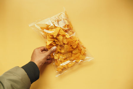 holding a open chips packet top view