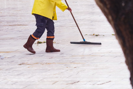 Using a mop to clean the hardwood floor with a wooden leg