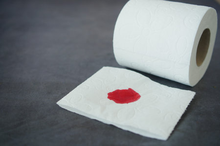 Blood on the tissues on light green backgroundの写真素材